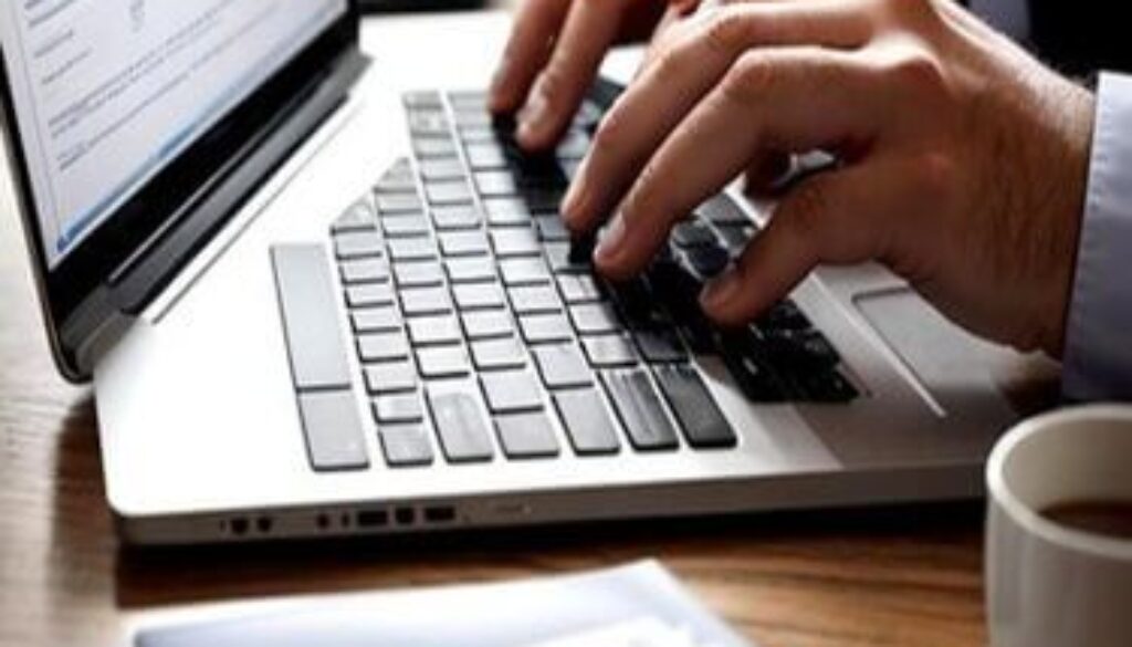 seo expert in kannur typing something on laptop