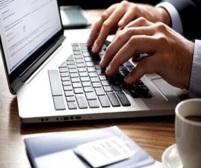 seo expert in kannur typing something on laptop