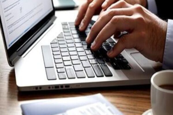 seo expert in kannur typing something on laptop